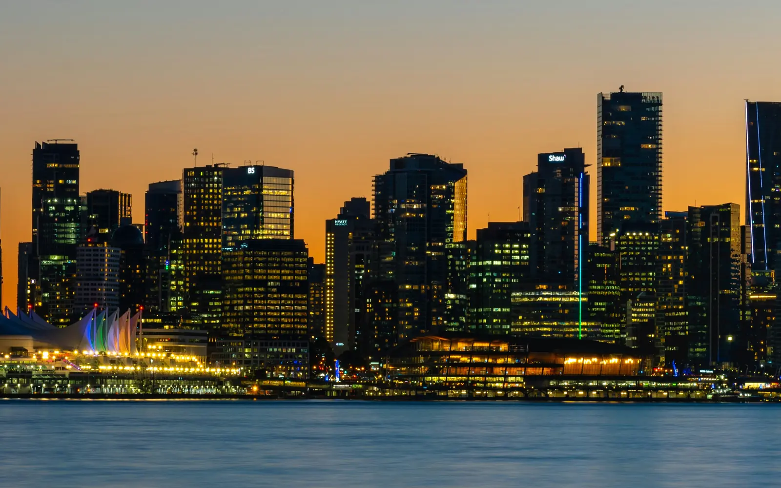 Downtown Vancouver skyline at sunset, seen across the harbour